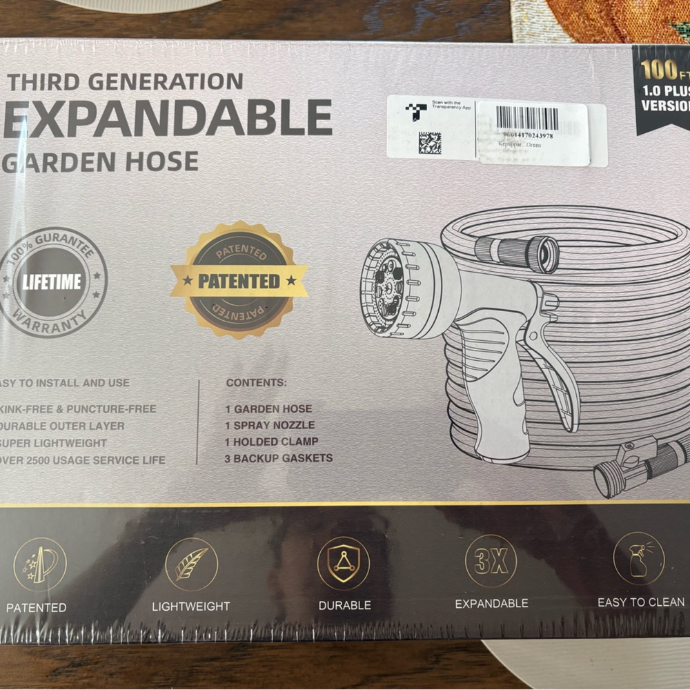 Expandable 100ft garden hose in Jungle Green with spray nozzle